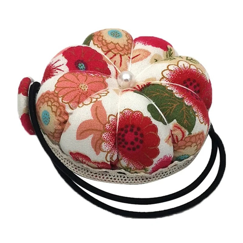 Coussin de poignet pour aiguilles avec dragonne